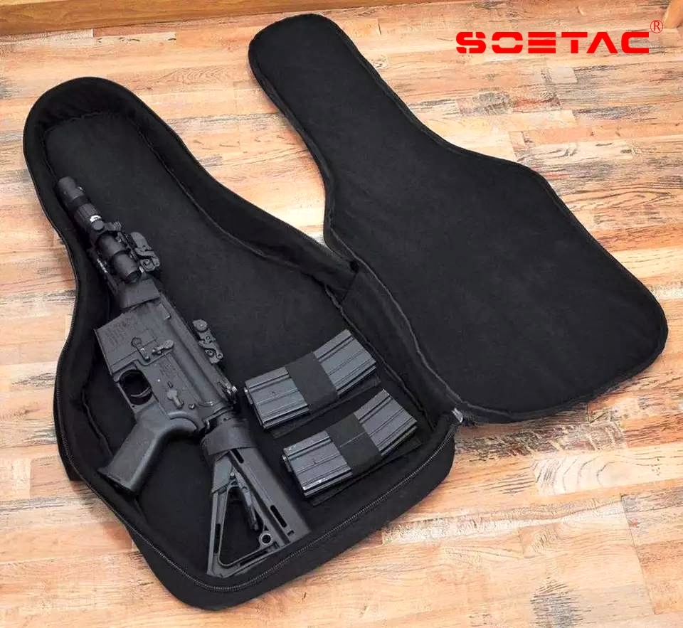 กระเป๋าใส่ปืน ทรงกีต้าร์ ผลิตจากผ้า Nylon 600D ภายในบุฟองน้ำกันกระแทก อย่างดี มีตัวสายรัด 4 จุด สามารถเคลื่อนย้ายได้ ภายนอกมี ช่องใส่ของเอนกประสงค์ ด้านหลังมีสาย สำหรับเป้ได้ ขนาด 15*31 นิ้ว ราคาส่ง