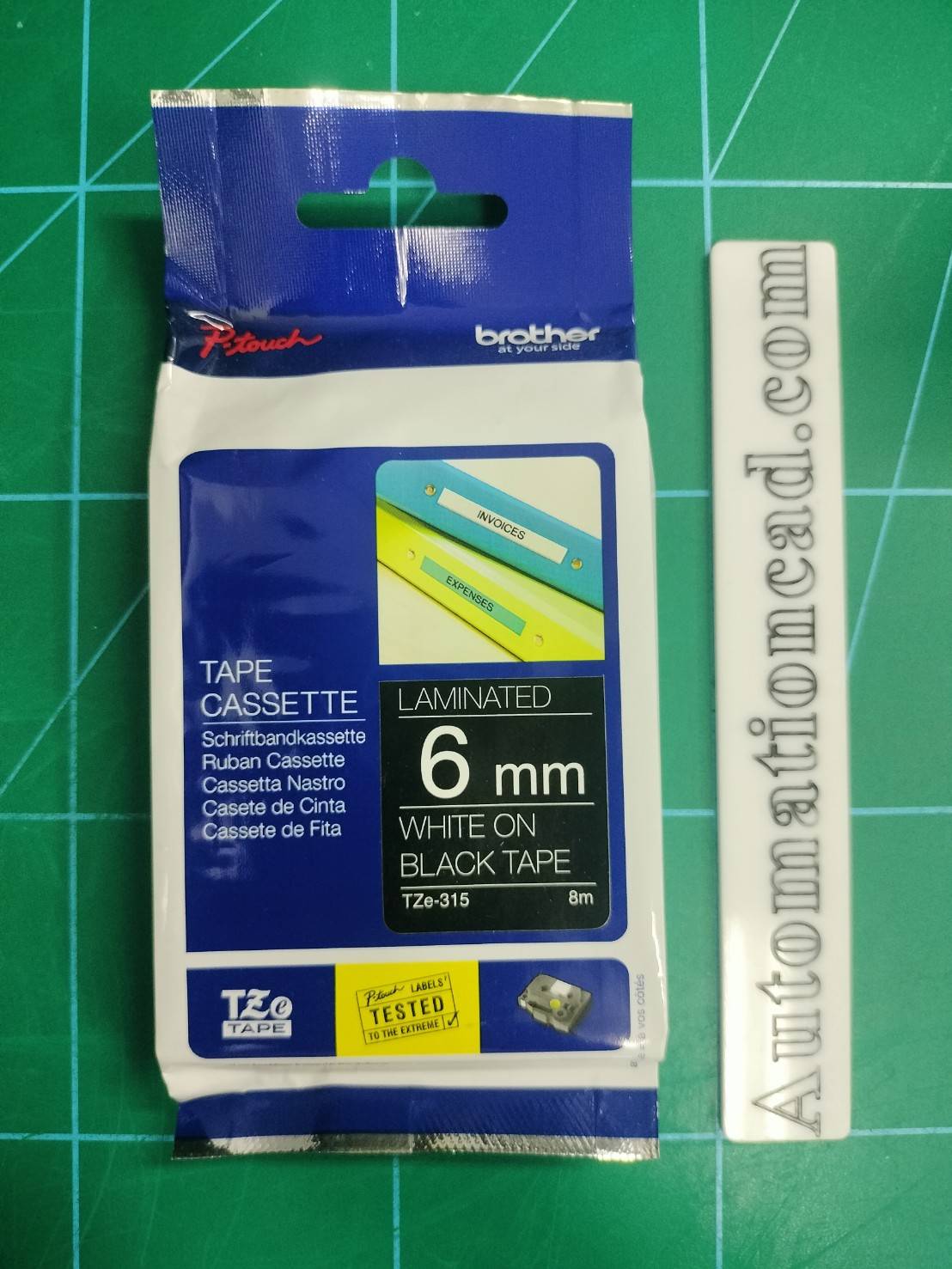 เทปพิมพ์อักษร TZE-315 6 มม. BROTHER ของแท้ อักษรสีขาว พื้นสีดำ