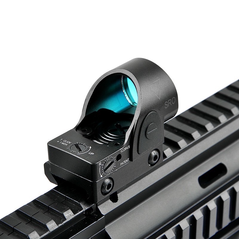 New.Trijicon SRO Red Dot ผลิตจากวัสดุ Aluminum ทำผิว hard anodized ขนาด 2.5 MOA Dot Red dot สีแดง คมชัด รูปร่างขนาดเล็ก Low Profile มาพร้อมขาจับ mount แบบ 20 มม. และ Glock mount ( บีบีกัน ) ปรับระดับความสว่างง่าย +/- ด้านข้าง Battery : 1*CR2032 (แถมมา) แถ