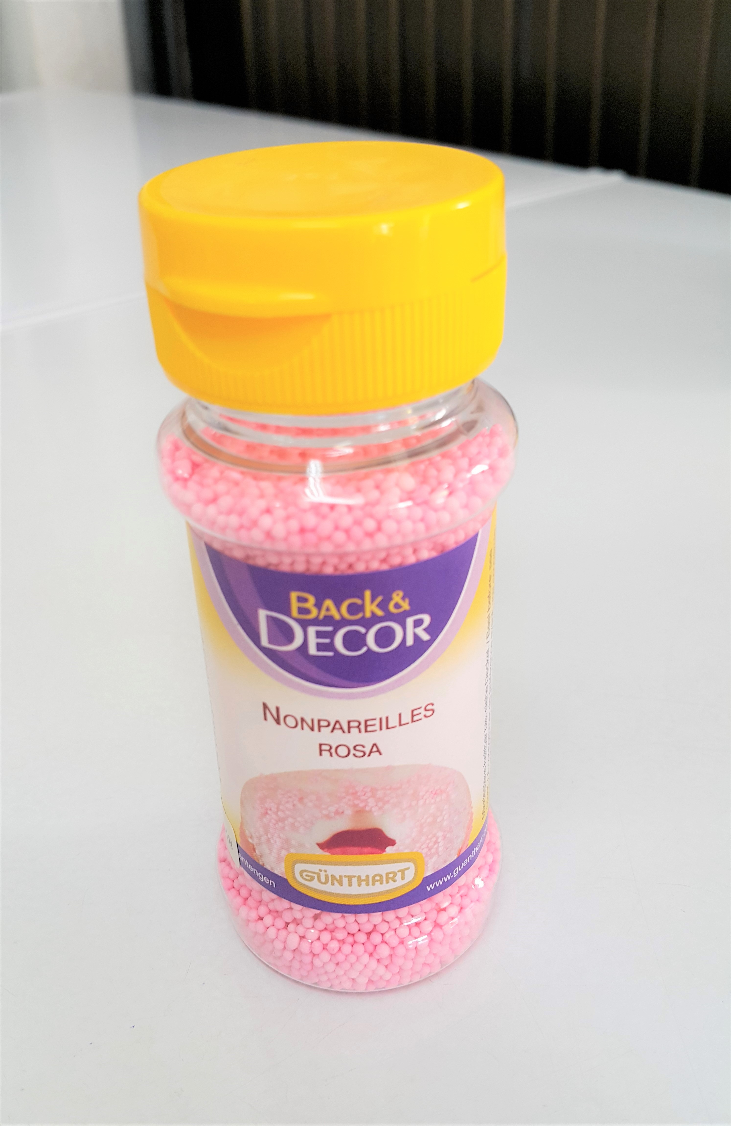 เม็ดน้ำตาลกลม สีชมพู 85g. ตรา Back & Decor