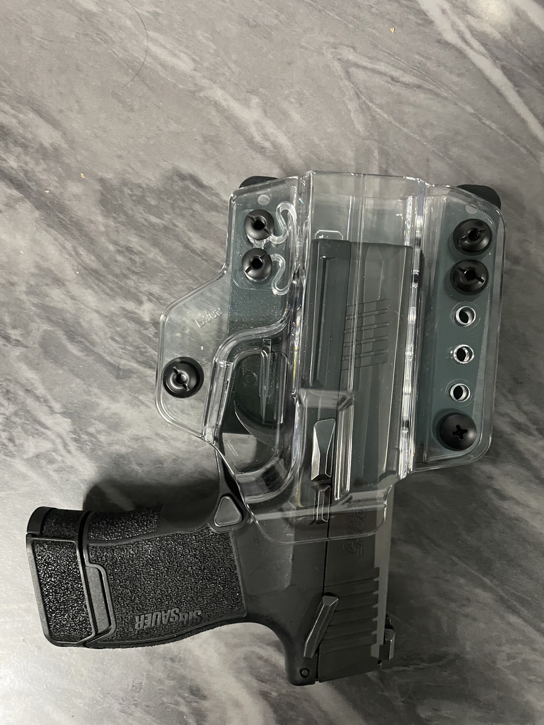 New.ซองพกนอก/ใน Sig P365 ( ซองใส ) 🔹 ผลิตจาก Polymer เกรดคุณภาพ 🔹 สำหรับรุ่น ig P365 🔹 สลับใช้ได้ทั้งพกนอกและพกใน 🔹 สลับใช้ได้ทั้งคนถนัดซ้ายและขวา 🔹 สามารถใช้งานร่วมกับ Dot ได้ 🔹 ตัวซองสามารถปรับกระชับได้ &#