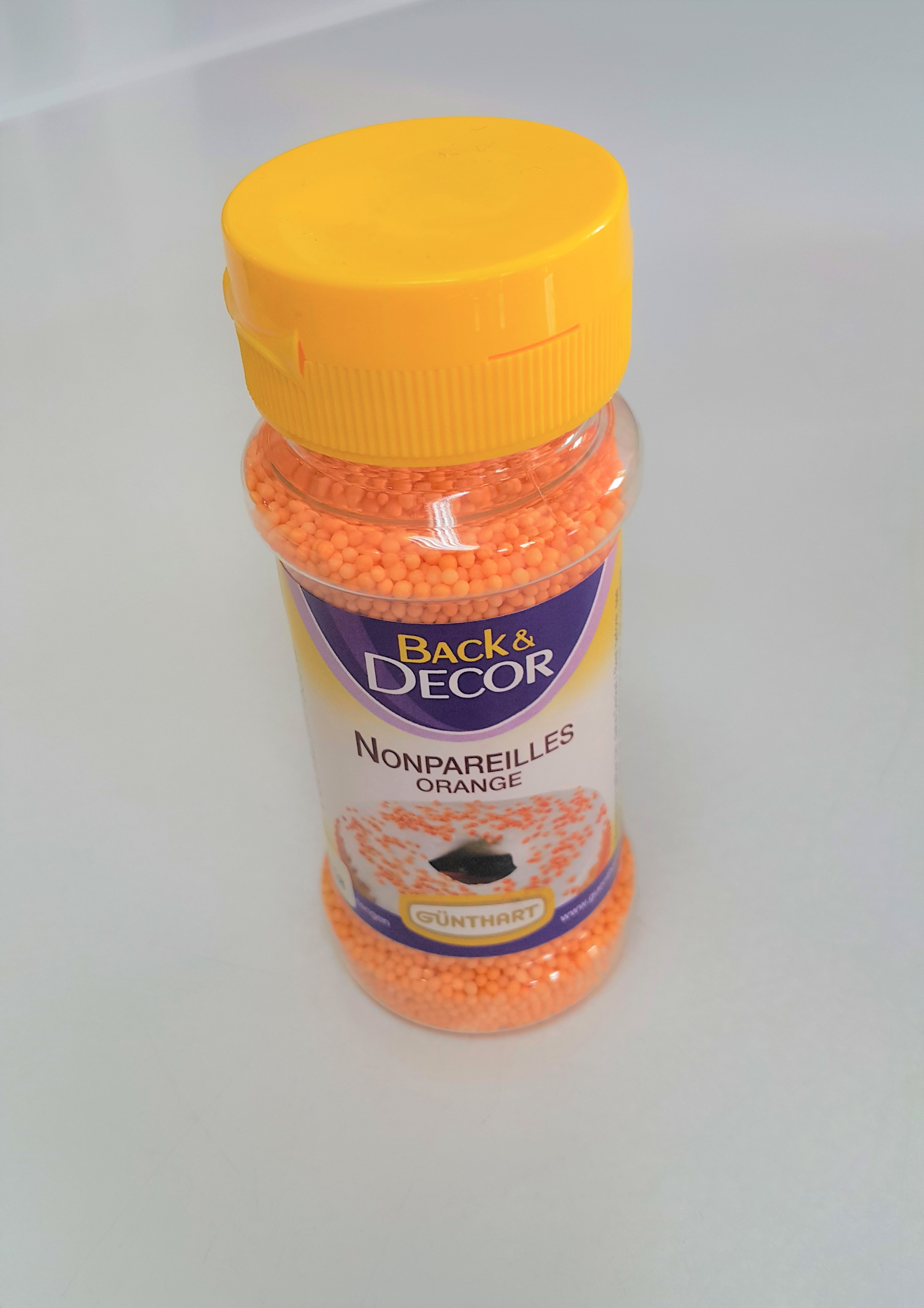 เม็ดน้ำตาลกลม สีส้ม 85g. ตรา Back & Decor
